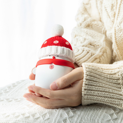 Regalo de Navidad dibujos animados mini portable Tesoro de nieve cálido Tesoro de mano 2 en 1 Banco de energía