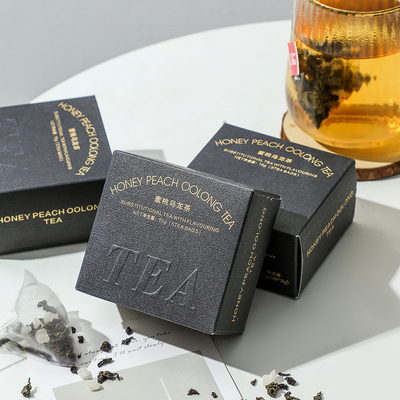 Relaciones con los ex alumnos Té regalo melocotón té oolong en embalaje de estampado en caliente Actividad del 8 de marzo