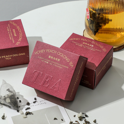 Relaciones con los ex alumnos Té regalo melocotón té oolong en embalaje de estampado en caliente Actividad del 8 de marzo