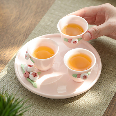 Hermoso juego de té de cerámica rosa regalo ideal para mujeres durante el festival de la diosa