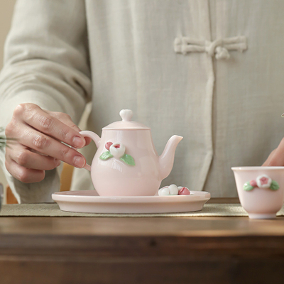 Hermoso juego de té de cerámica rosa regalo ideal para mujeres durante el festival de la diosa