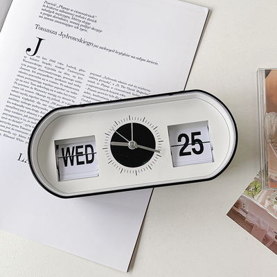 Reloj de alarma de escritorio con botón manual con calendario de página creativa